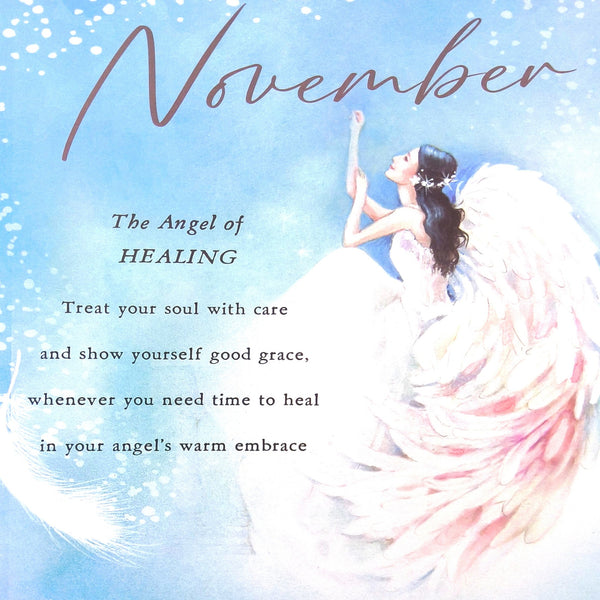 2027 Angels Tall Slim Wall Calendar November Quote with a light blue watercolor background, the word 'November' in large script at the top, and text reading 'The Angel of HEALING' plus a supportive message about healing. An illustrated angel in a white gown with pink-tinted wings appears on the right side.