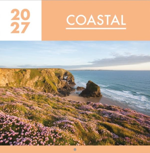 A coastal landscape print or poster showing rocky cliffs, blue ocean water, and pink-purple wildflowers in the foreground, with a peach header reading '2027' and 'COASTAL'.