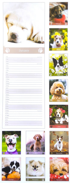A vertical dog-themed calendar page showing a large sleeping puppy photo at the top, a monthly writing area labeled January, and multiple small dog photos along the right side.