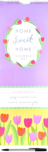 A spiral-bound wall calendar titled 'Home Sweet Home' with a pastel purple top section, floral wreath illustration, and a lower section showing colorful tulips in pink, orange, and yellow. A black pen is placed at the bottom.