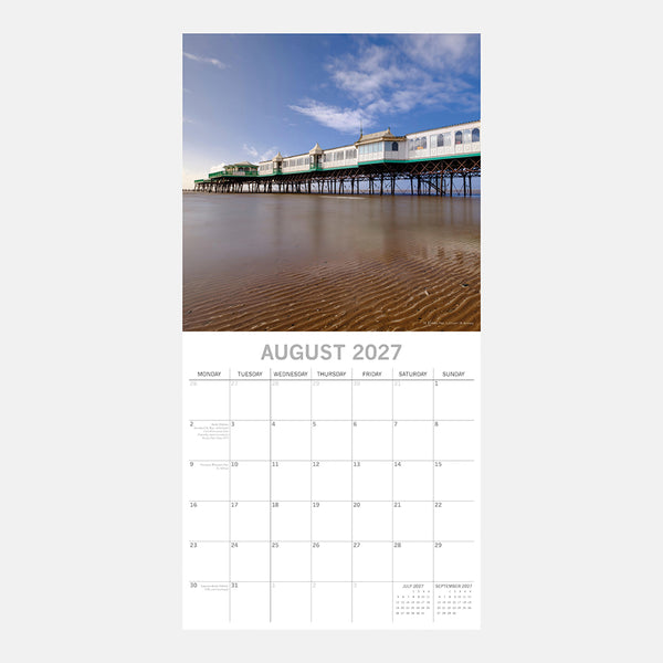 Lancashire Calendar page for August 2027 with a beach and St Annes pier image on a white background