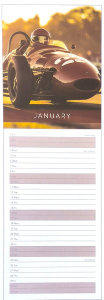 A tall January wall calendar page featuring a vintage race car in warm golden light on the top half and a lined monthly planner layout on the bottom half.