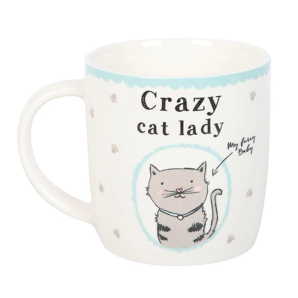 Crazy Cat Lady Mug

* White Mug.
* Presentation Box
* Size: 9cm x 8.7cm (Not including handle)
* Made by Something Different under the Jones Home &amp; Gift brand


This Crazy Cat Lady Mug Cup is a white ceramic round coffee mug featuring a novelty design with a cat character. It is perfect for cat lovers and can be used for tea, coffee, or other liquids. The mug includes a presentation box, making it a great gift for various occasions such as Easter, Christmas, birthdays, and more. It is microwave and dish