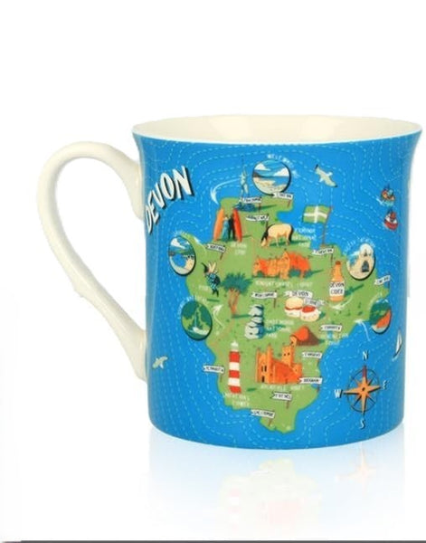 A white ceramic mug featuring a colorful illustrated map of Devon, England, with a bright blue background and white handle and interior.
