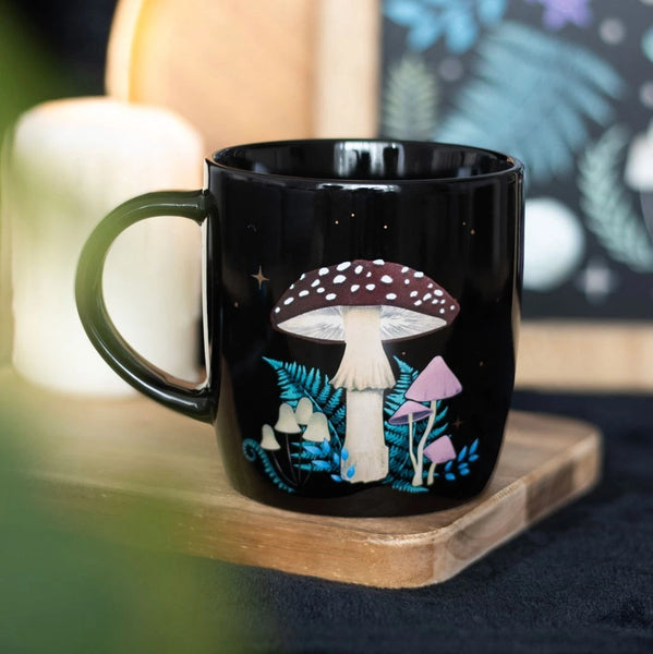 Forest Mushroom Mug

* Black Mug.
* Presentation Box
* Size: 9.3cm x 8.8cm (Not including handle)
* Made by Something Different under the Jones Home &amp; Gift brand


Start your day with a sip of serenity from this rounded mug featuring a magical forest mushroom print. Great for hot drinks on dreamy mornings or quiet evenings under the moonlight. 500ml capacity. Microwave safe. Dishwasher safe.

It is perfect for tea, coffee, or other liquids.

The mug includes a presentation box, making it a great gift fo