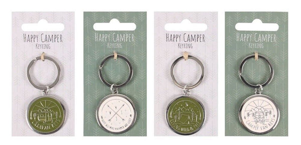 Four Happy Camper keychains on display cards, featuring green and silver circular medallion pendants with camping-themed illustrations and text.