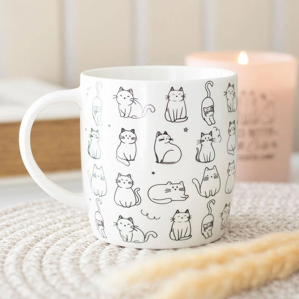 This White Happy Cat Mug is a charming ceramic cup featuring a novelty design of kittens, perfect for enjoying tea, coffee, or espresso.