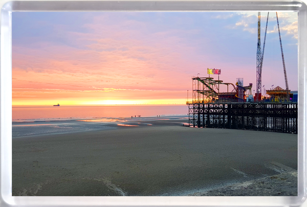 Jumbo Blackpool fridge magnet showing a sunset on the beach, pier and sea.