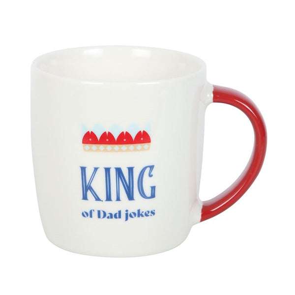 White mug with red handle and 'King of Dad Jokes' text on a white background