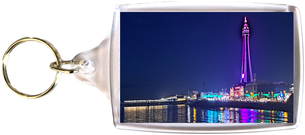 Large Blackpool Keyring showing a purple Blackpool Tower and the Illuminations reflecting in the sea.