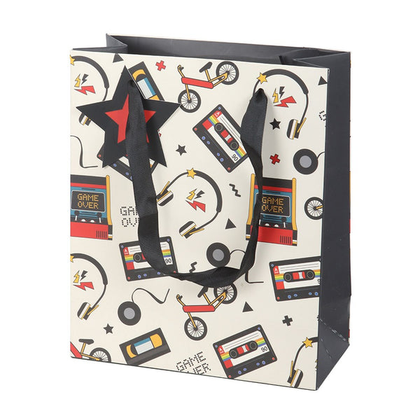 Gift bag with retro design featuring cassette tapes, game consoles, and bicycles on a white background.