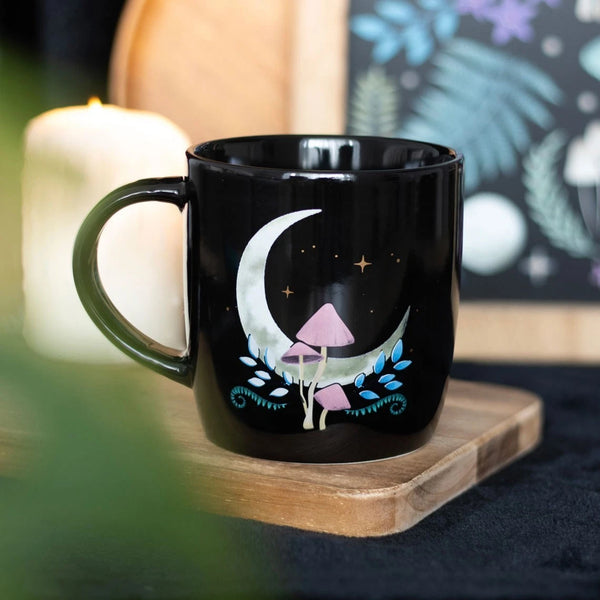 Mystical Moon &amp; Mushroom Mug

* Black Mug.
* Presentation Box
* Size: 9.4cm x 8.9cm (Not including handle)
* Made by Something Different under the Jones Home &amp; Gift brand


Start your day with a sip of serenity from this rounded mug featuring a mystical moon and mushroom print. Great for hot drinks on dreamy mornings or quiet evenings under the moonlight. 500ml capacity. Microwave safe. Dishwasher safe.

It is perfect for tea, coffee, or other liquids.

The mug includes a presentation box, making it