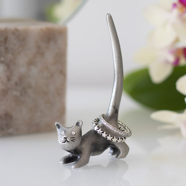 Metal Cat Ring Holder  Iron Holds Rings Can be used as a cute standing ornament Place on desk, vanity drawers, shelves and more Keep your rings safe and in one place 9cm x 5cm x 2cm  Cute and quirky alternative to a jewellery box.  Ideal gift for cat lovers.