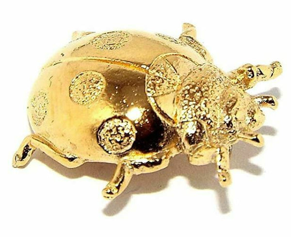 Gold plated pewter ladybird badge with a butterfly clip