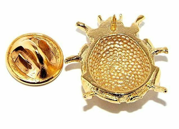 Gold plated pewter ladybird badge with a butterfly clip